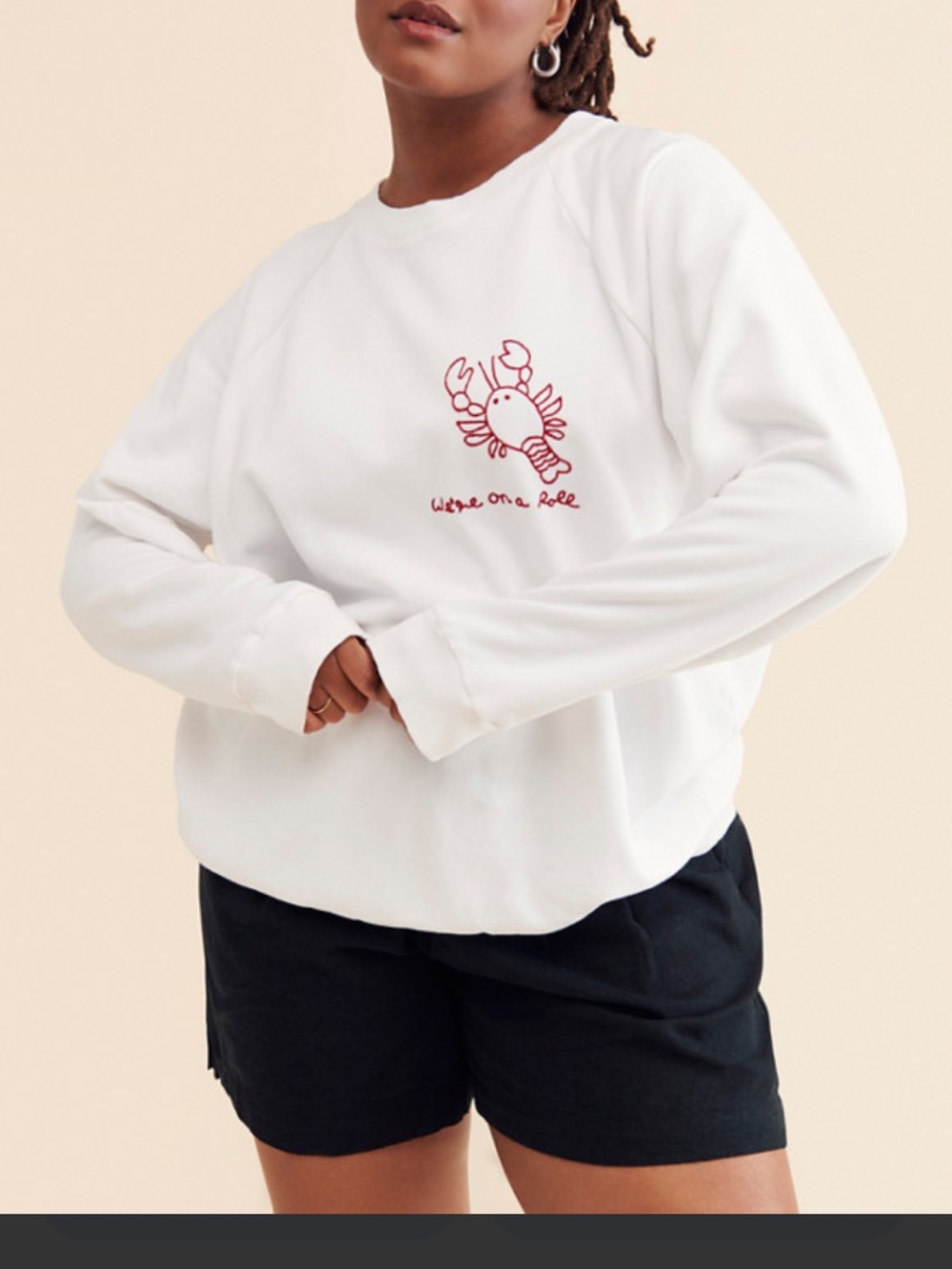 white crewneck sweatshirt by Banner Day featuring a red embroidered lobster